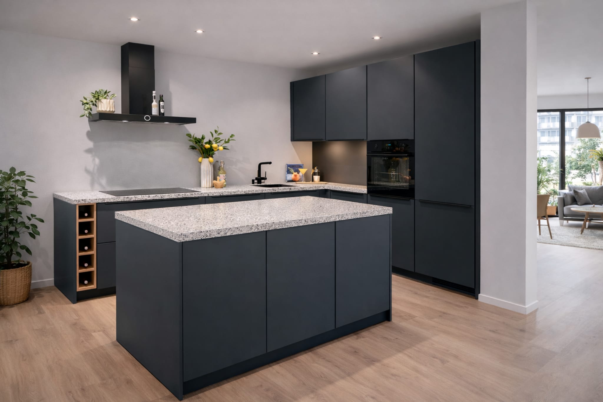 Moderne Kitchen4All L-keuken met kookeiland, donkergrijze matte fronten en een lichtgrijs composiet werkblad.