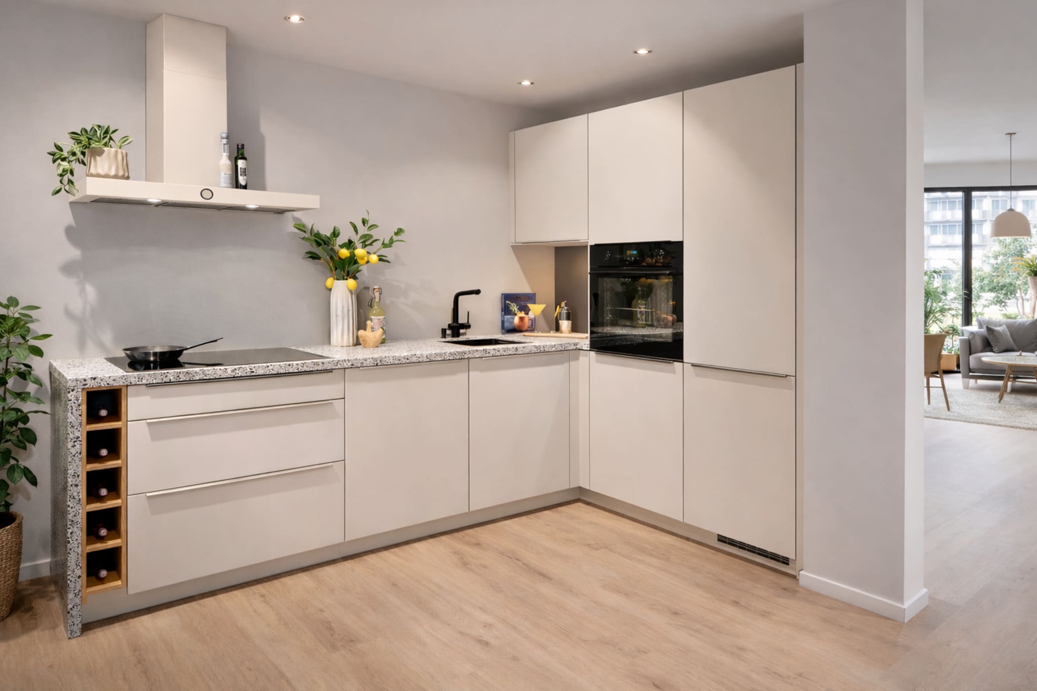 Moderne Kitchen4All L-keuken met matte grijze fronten en een grijs composiet werkblad.