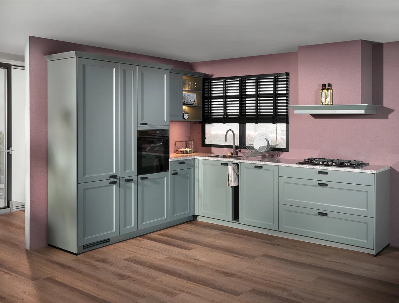 Grijsgroene keuken met kaderfronten en een wit werkblad tegen een roze wand