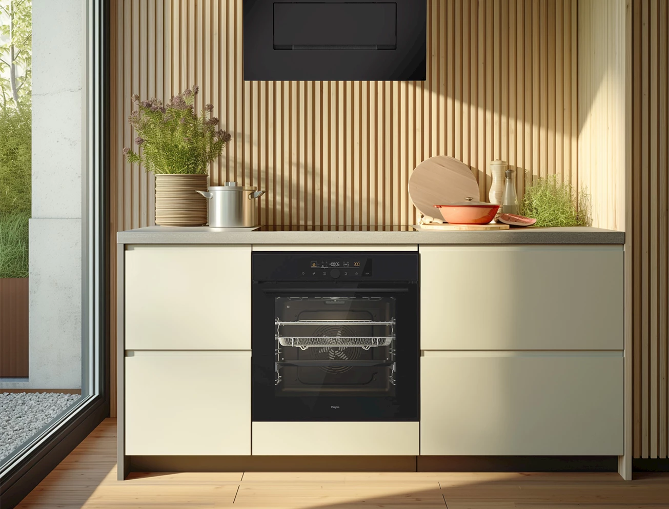 Inbouwoven onder het werkblad van een lichtgroene keuken met houten lamellenwand